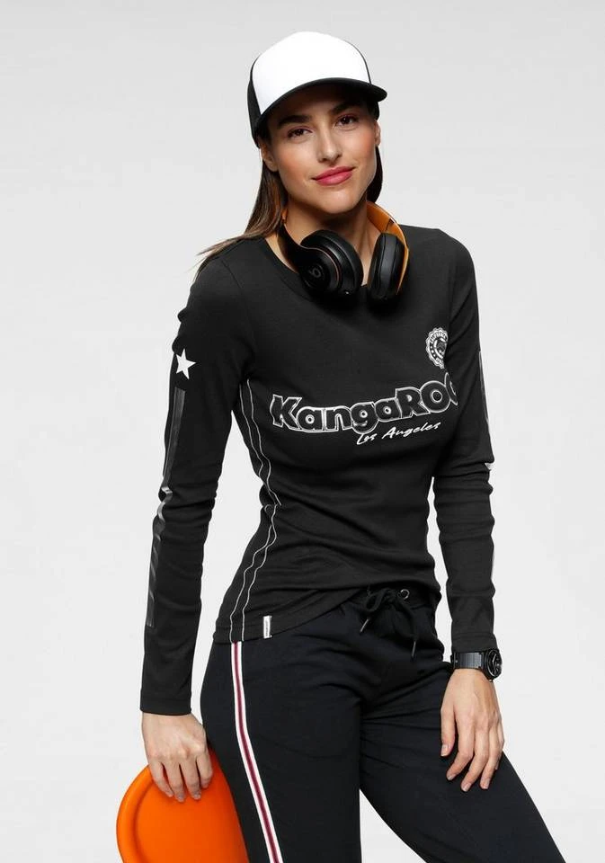 0b8571fc-c14c-5404-9ccf-e953b4aa9cb6.jpg KangaROOS Langarmshirt mit Druck und Streifen am Ärmel Weiß-bedruckt-blau, Schwarz-bedruckt-silberfarben-weiß, Blau-bedruckt-weiß-silberfarben -KANGAROOS Verkäufe 0b8571fc c14c 5404 9ccf e953b4aa9cb6