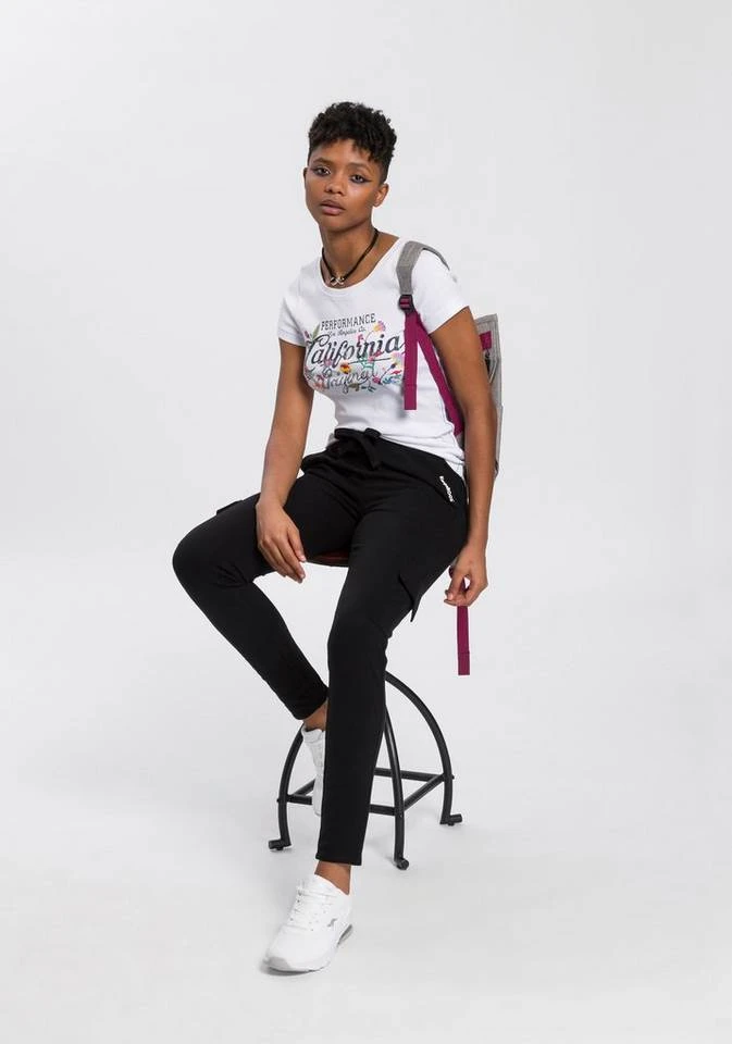 e7b4cf10-f4e8-5b18-a5aa-b1f7e3170f8b.jpg KangaROOS T-Shirt mit blumigen Logodruck im Vintage-Retro-Look - NEUE KOLLEKTION Blau-melange, Weiß -KANGAROOS Verkäufe e7b4cf10 f4e8 5b18 a5aa b1f7e3170f8b